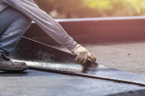 Professional Basement Waterproofing technician working in Chesterhill, OH